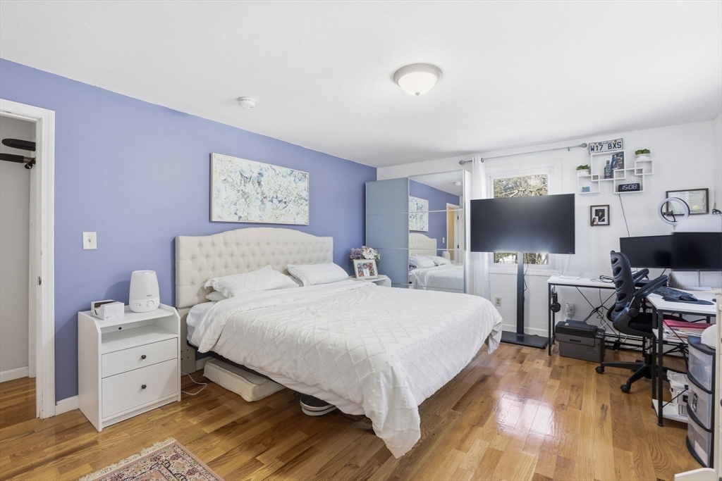 97 Chicopee Row Groton, MA 01450 - Photo 27 of 41 a bedroom with a bed and a flat screen tv