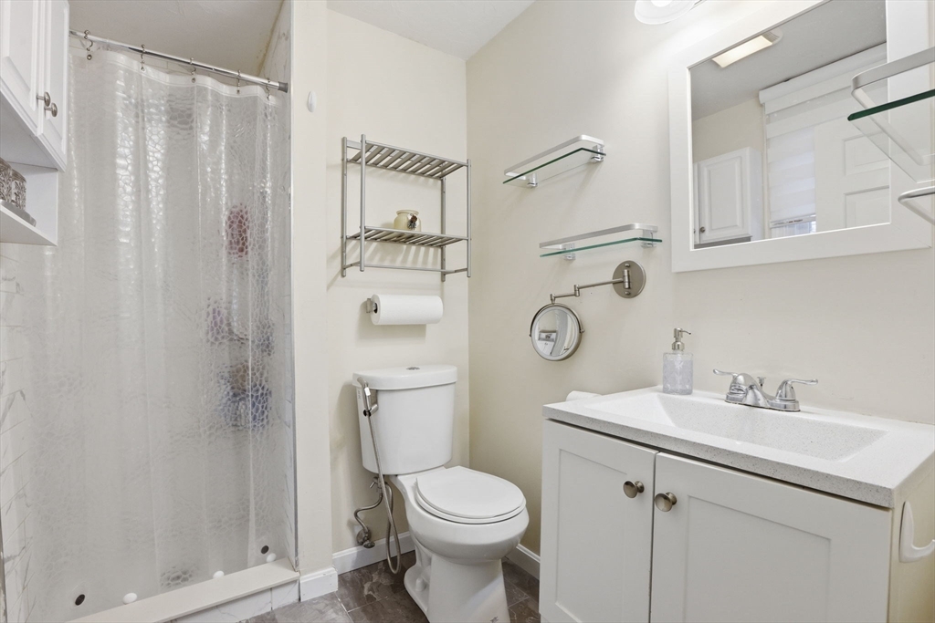 97 Chicopee Row Groton, MA 01450 - Photo 29 of 41 a bathroom with a sink a toilet and shower