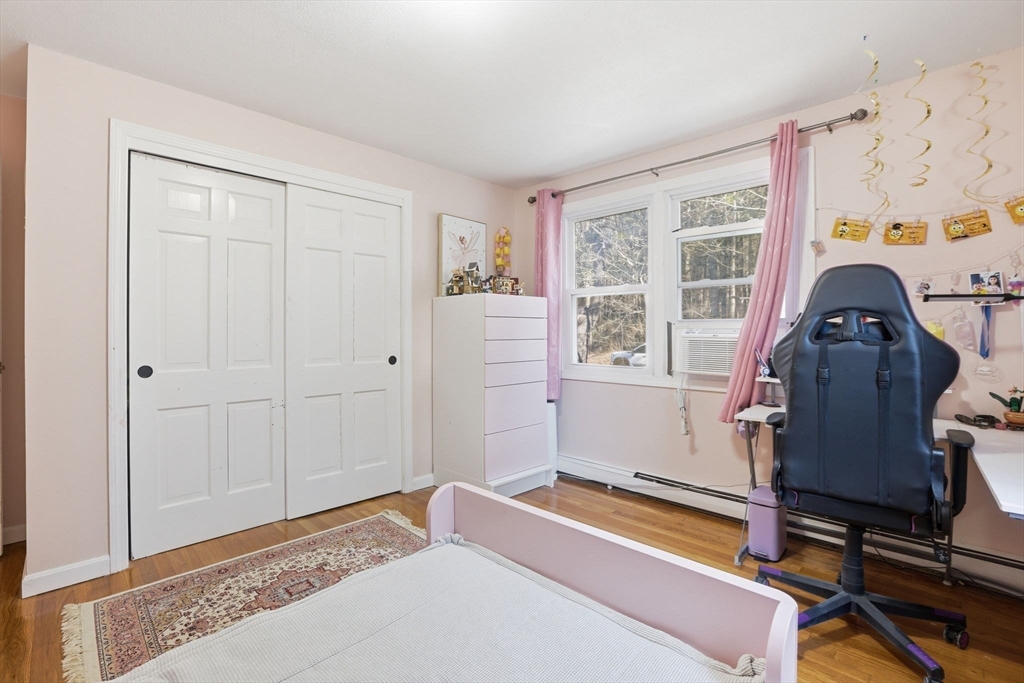 97 Chicopee Row Groton, MA 01450 - Photo 31 of 41 a bedroom with a bed and a window