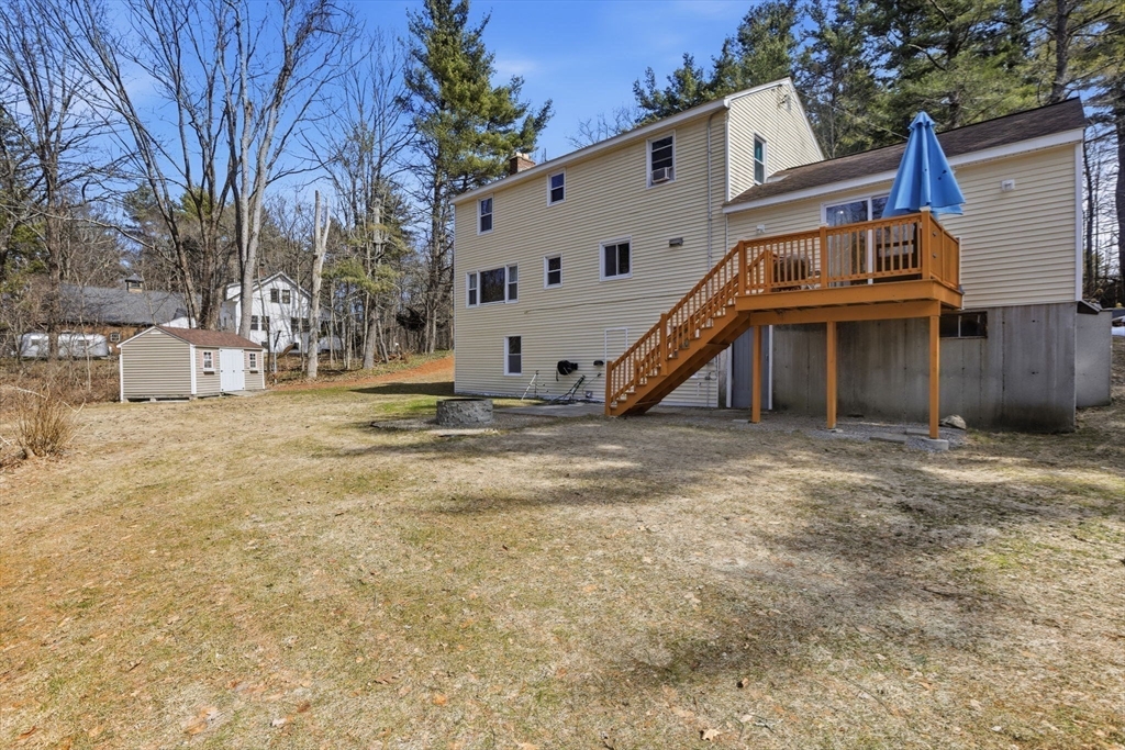 97 Chicopee Row Groton, MA 01450 - Photo 37 of 41 a view of a house with a yard