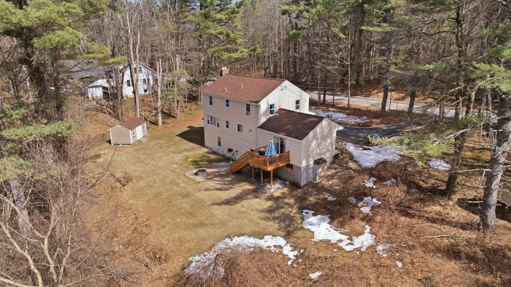 97 Chicopee Row Groton, MA 01450 - Photo 39 of 41 a view of a house with a yard and sitting area