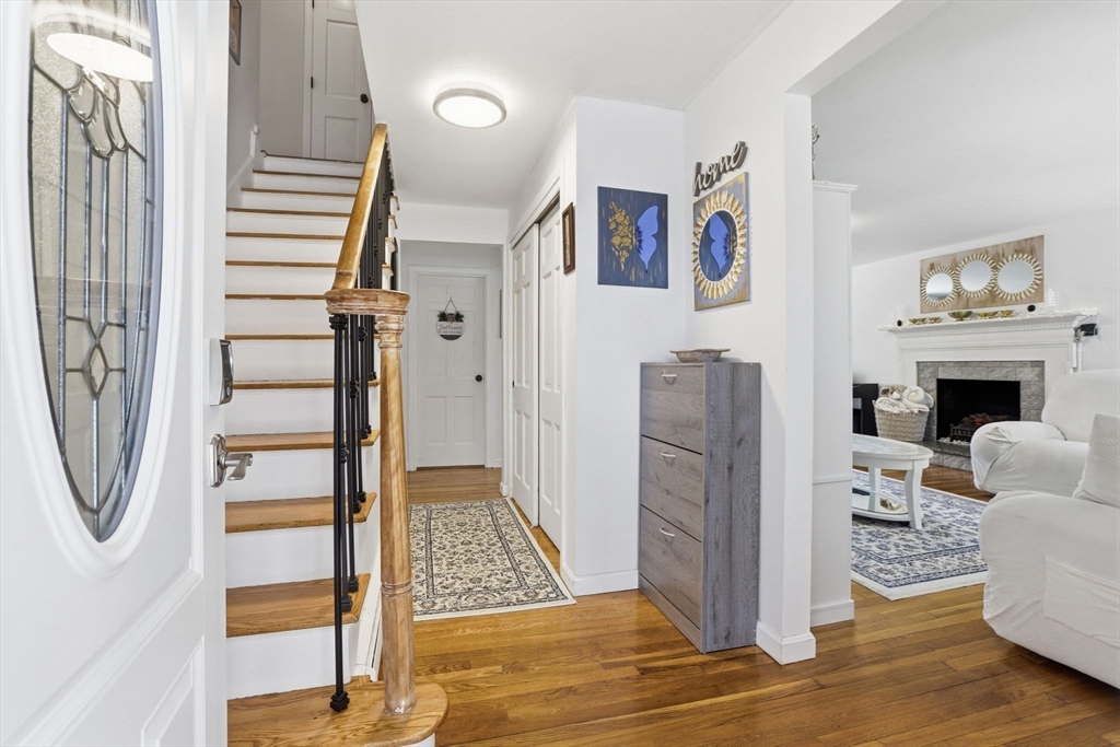 97 Chicopee Row Groton, MA 01450 - Photo 4 of 41 a view of a livingroom with furniture and staircase