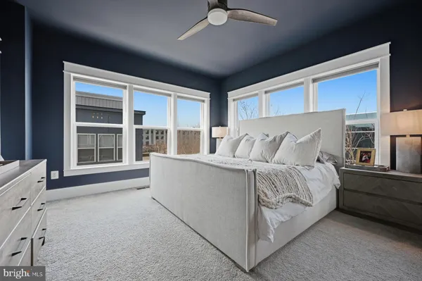 a bed sitting in a room next to a window