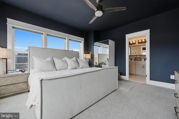 a bed room with a bed and a television