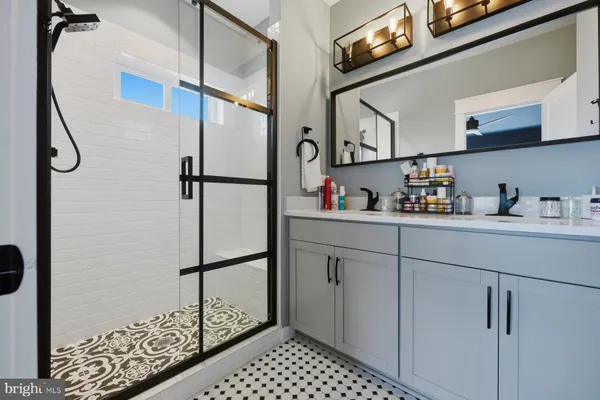 a kitchen with a refrigerator and cabinets
