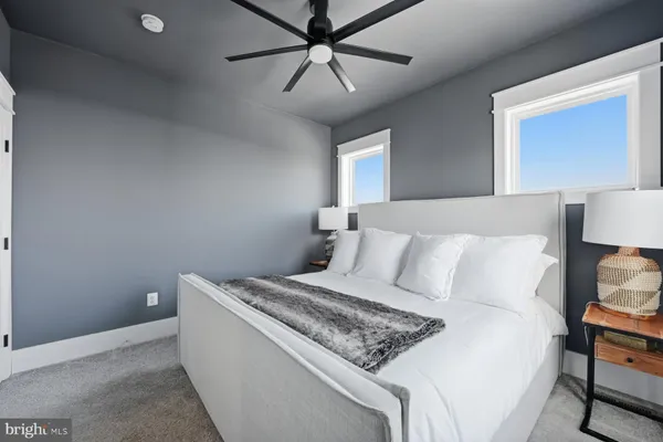 a bed room with a bed and a night stand