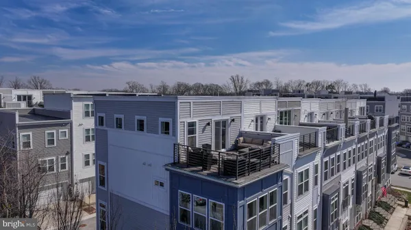 a view of a hallway and a livingroom with furniture