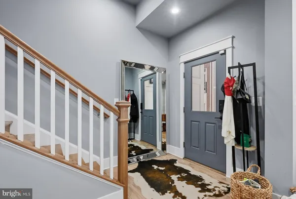 a view of a workspace with furniture window and wooden floor