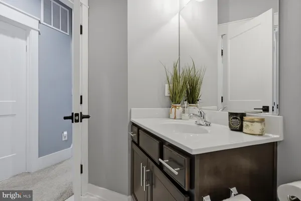 a view of a patio with a table and chairs and potted plants