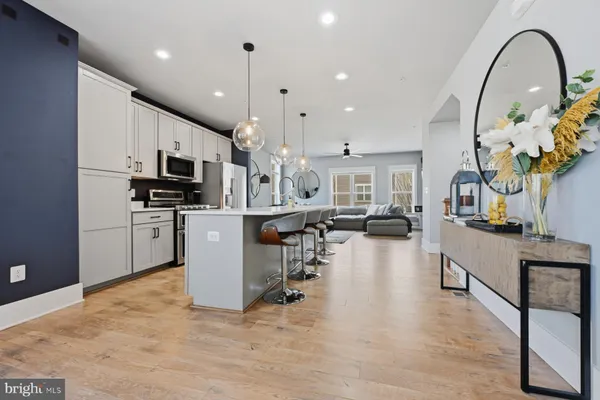 a living room filled with furniture and a flat screen tv