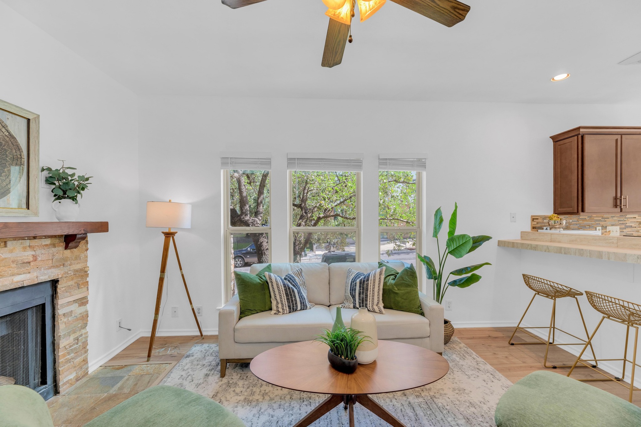 2414 Longview Street, Unit 101 Austin, TX 78705 - Photo 1 of 31 Living area with a fireplace, ceiling fan, recessed lighting, and light wood-style floors
