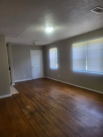 a kitchen with white cabinets and a sink