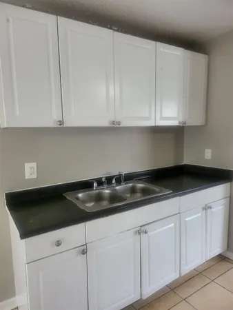 a bathroom with a sink a toilet and bathtub