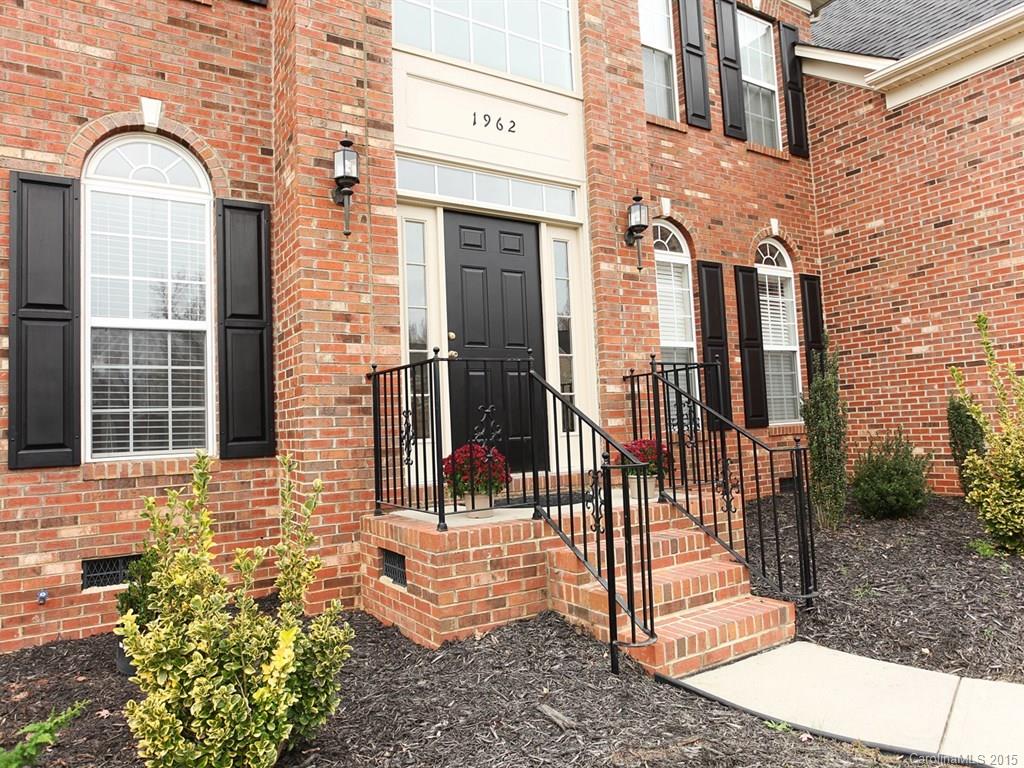 1962 Faison Avenue Fort Mill, SC 29708 - Photo 2 of 24 a view of a brick house with large windows