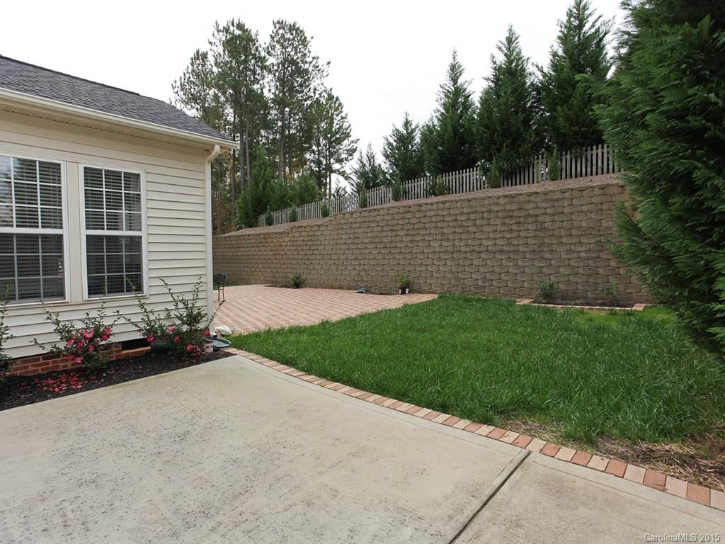 1962 Faison Avenue Fort Mill, SC 29708 - Photo 24 of 24 a brick house with a small yard and wooden fence