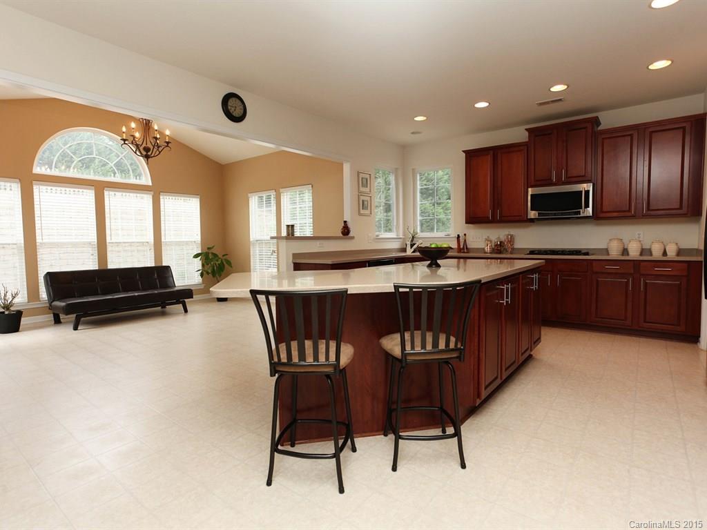 1962 Faison Avenue Fort Mill, SC 29708 - Photo 10 of 24 a kitchen with stainless steel appliances granite countertop a stove a sink and a refrigerator