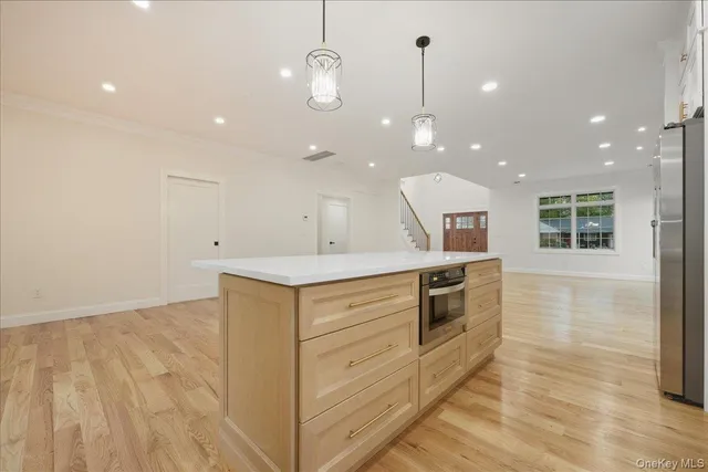 a view of a kitchen and dining room