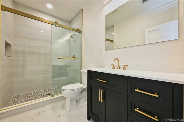 a view of an empty room and wooden floor