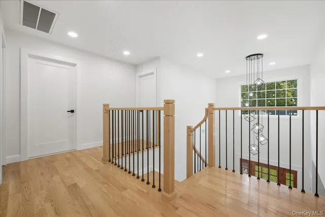 a bathroom with a toilet a sink and a mirror