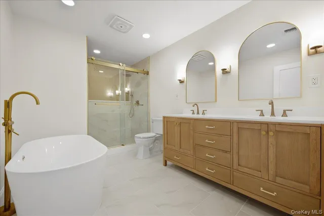 a spacious bedroom with a bed and furniture