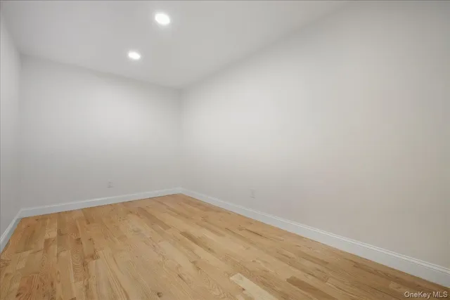 a bathroom with a double vanity sink mirror and toilet