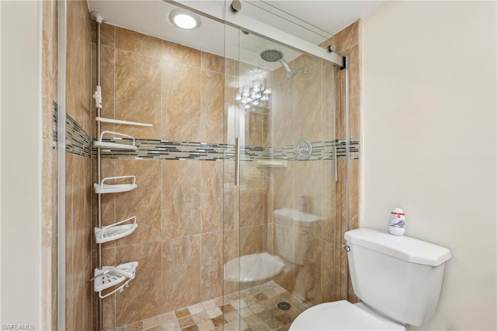 13345 Broadhurst Loop Fort Myers, FL 33919 - Photo 20 of 33 Bathroom featuring toilet and a shower stall