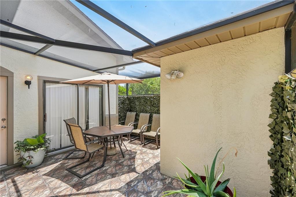 13345 Broadhurst Loop Fort Myers, FL 33919 - Photo 3 of 33 View of patio / terrace featuring outdoor dining space and a sunroom