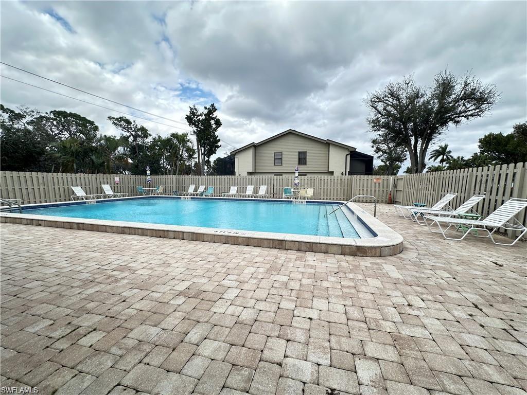 13345 Broadhurst Loop Fort Myers, FL 33919 - Photo 5 of 33 Community pool with a patio area