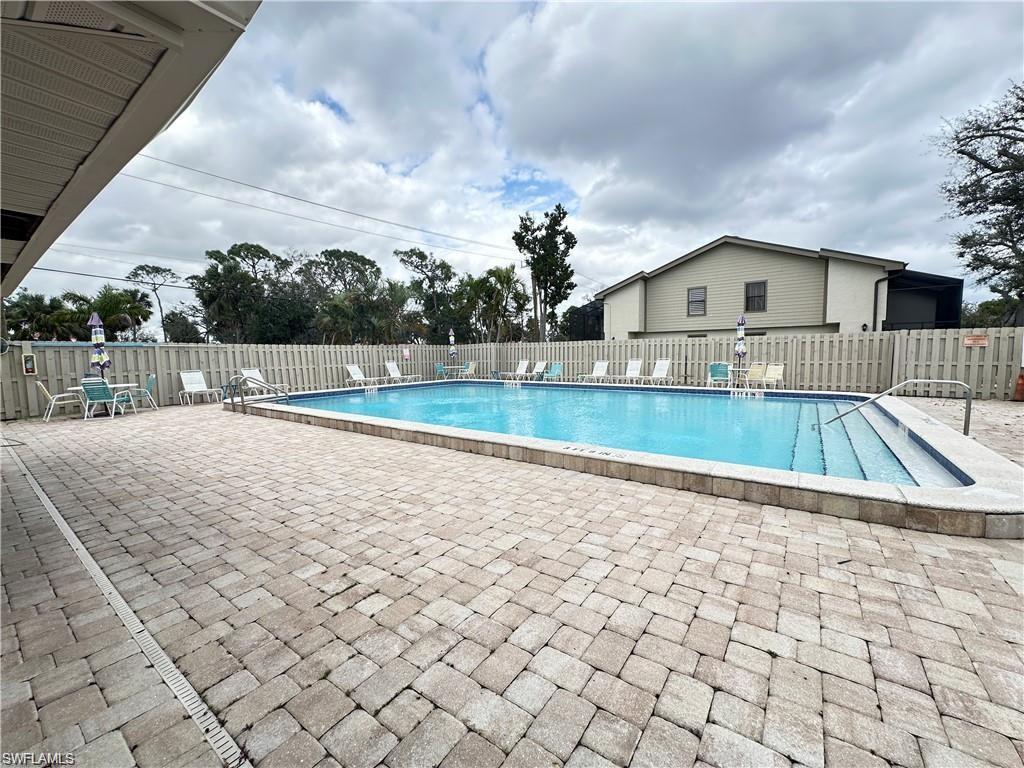 13345 Broadhurst Loop Fort Myers, FL 33919 - Photo 7 of 33 Community pool with a patio
