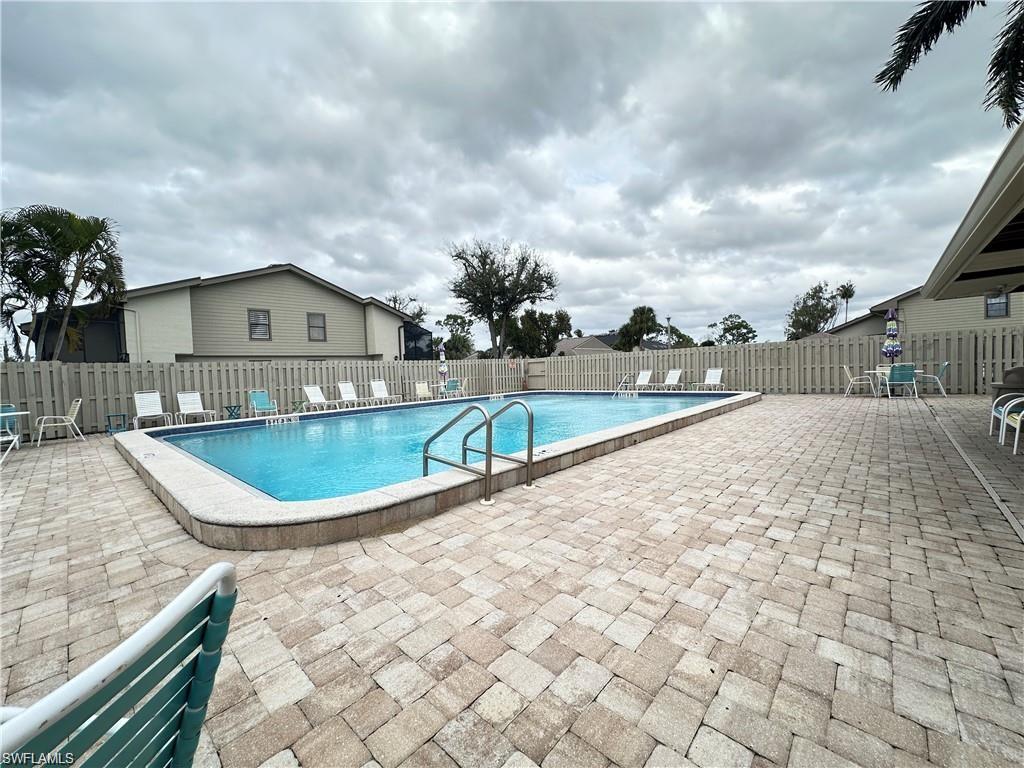 13345 Broadhurst Loop Fort Myers, FL 33919 - Photo 8 of 33 Community pool with a patio