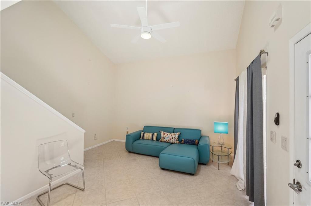 13345 Broadhurst Loop Fort Myers, FL 33919 - Photo 9 of 33 Living area with lofted ceiling and ceiling fan