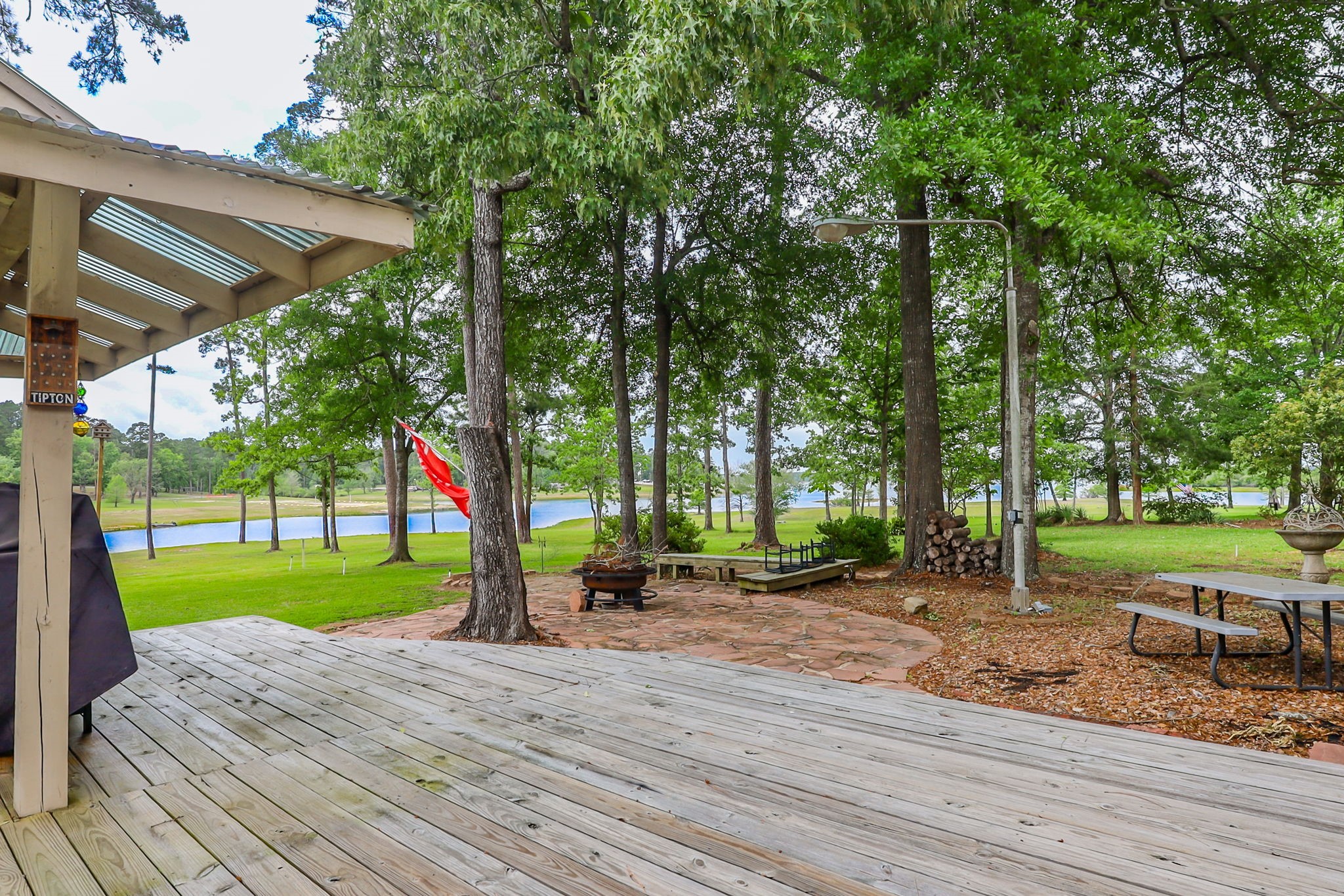 628 County Road 452 Bronson, TX 75930 - Photo 17 of 50 a view of a park with large trees and a table