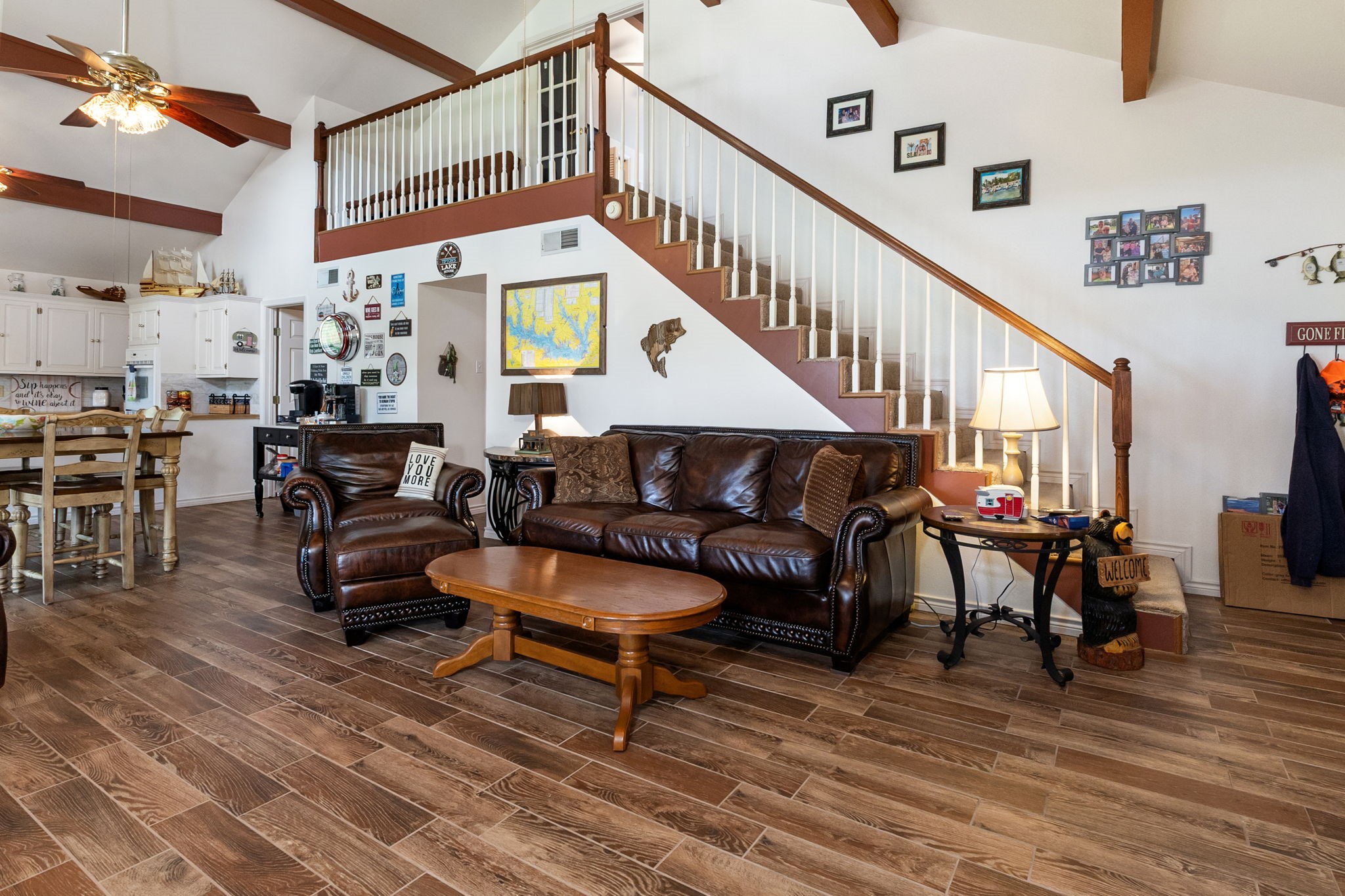 628 County Road 452 Bronson, TX 75930 - Photo 21 of 50 a living room with furniture a wooden floor and a chandelier