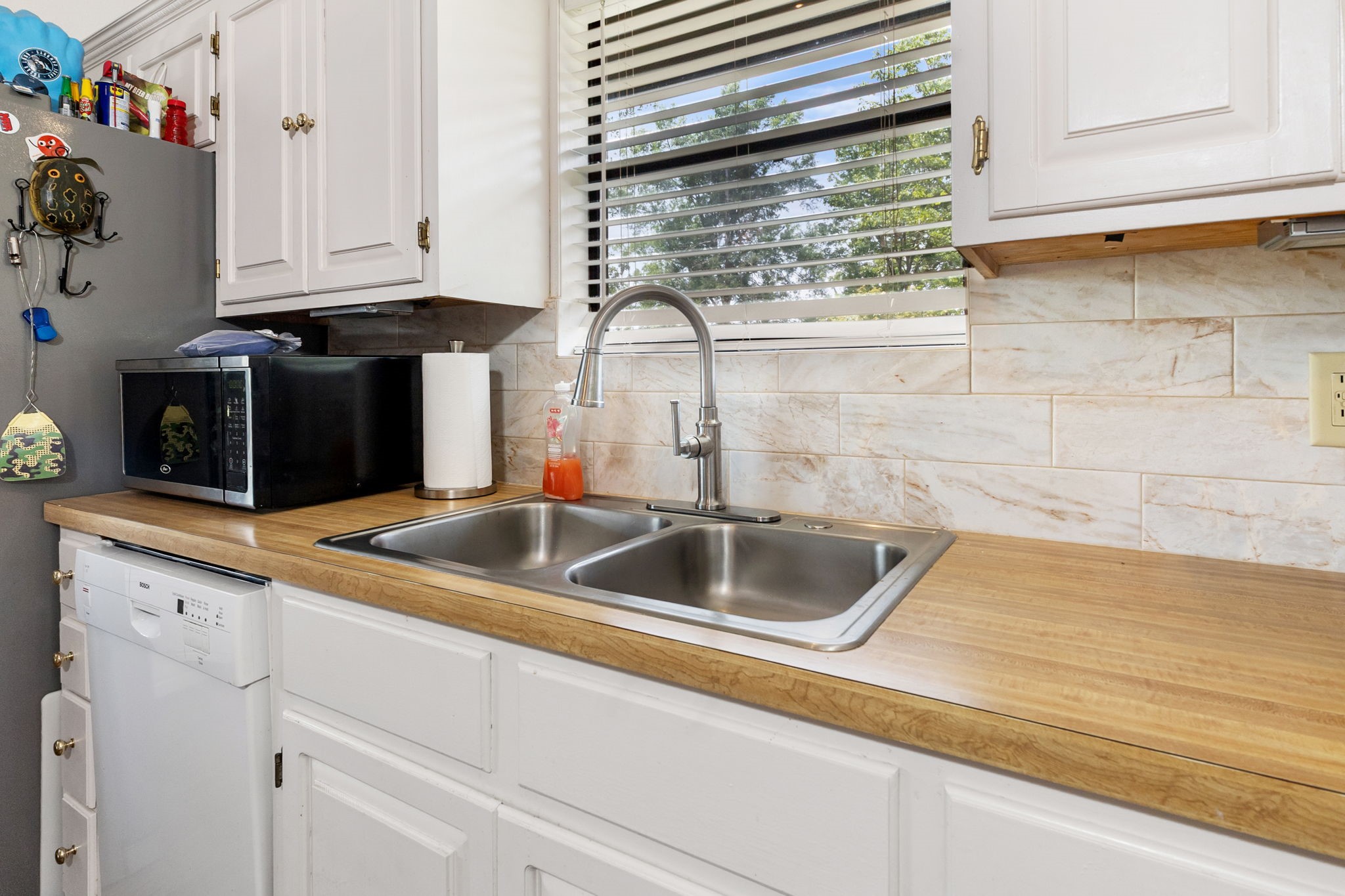 628 County Road 452 Bronson, TX 75930 - Photo 27 of 50 a kitchen with a sink and cabinets