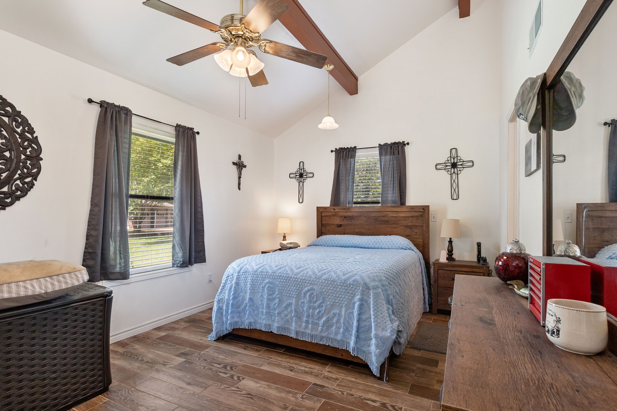628 County Road 452 Bronson, TX 75930 - Photo 29 of 50 a bedroom with a bed and dresser with mirror
