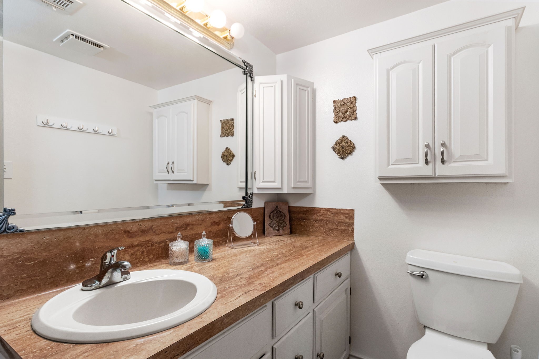 628 County Road 452 Bronson, TX 75930 - Photo 31 of 50 a bathroom with double vanity sink and a mirror
