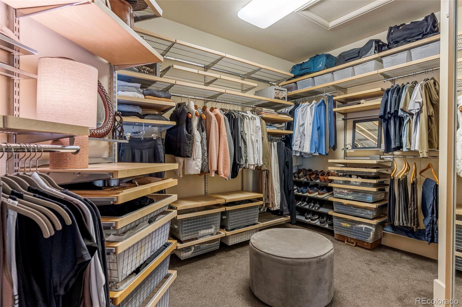 1323 South Snyder Gulch Road Evergreen, CO 80439 - Photo 22 of 47 a view of walk in closet with clothes and shoes