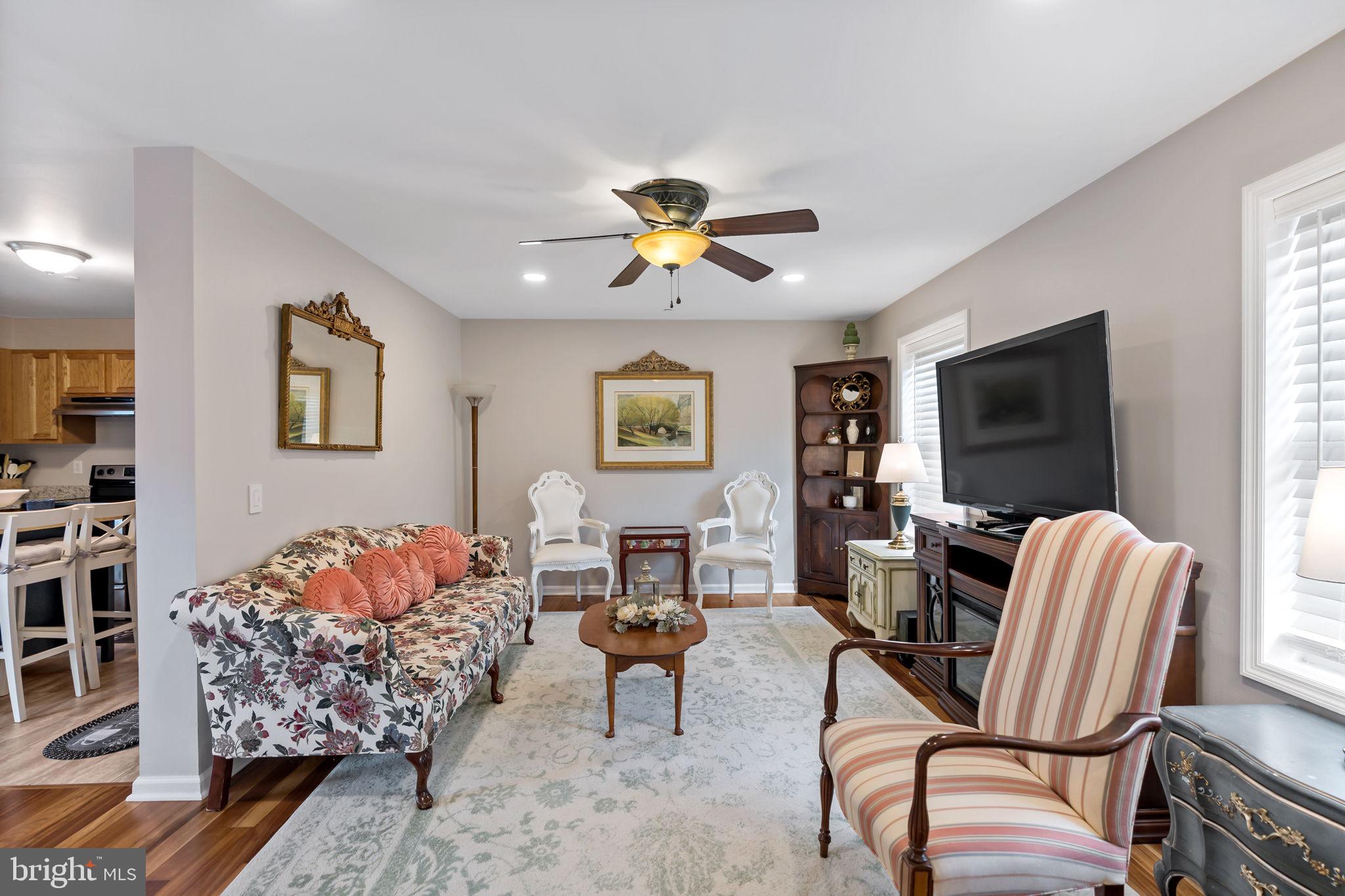 5632 Hines Road Frederick, MD 21704 - Photo 12 of 44 a living room with furniture and a flat screen tv