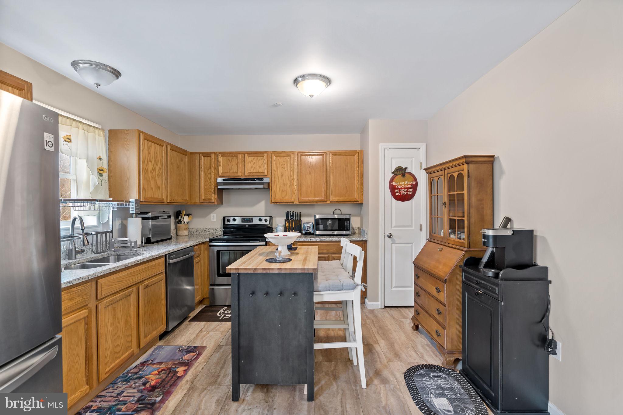5632 Hines Road Frederick, MD 21704 - Photo 16 of 44 a large kitchen with cabinets