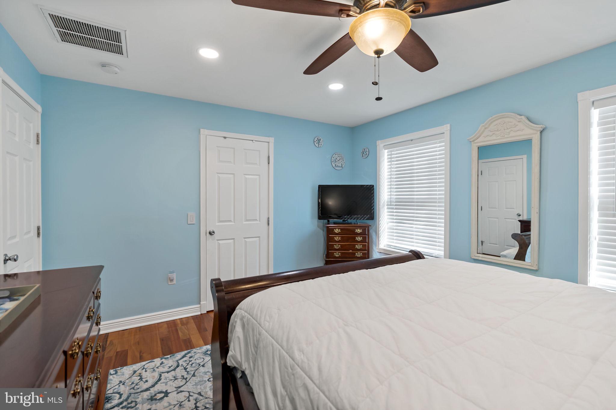 5632 Hines Road Frederick, MD 21704 - Photo 21 of 44 a bedroom with a bed and a flat tv screen on dresser