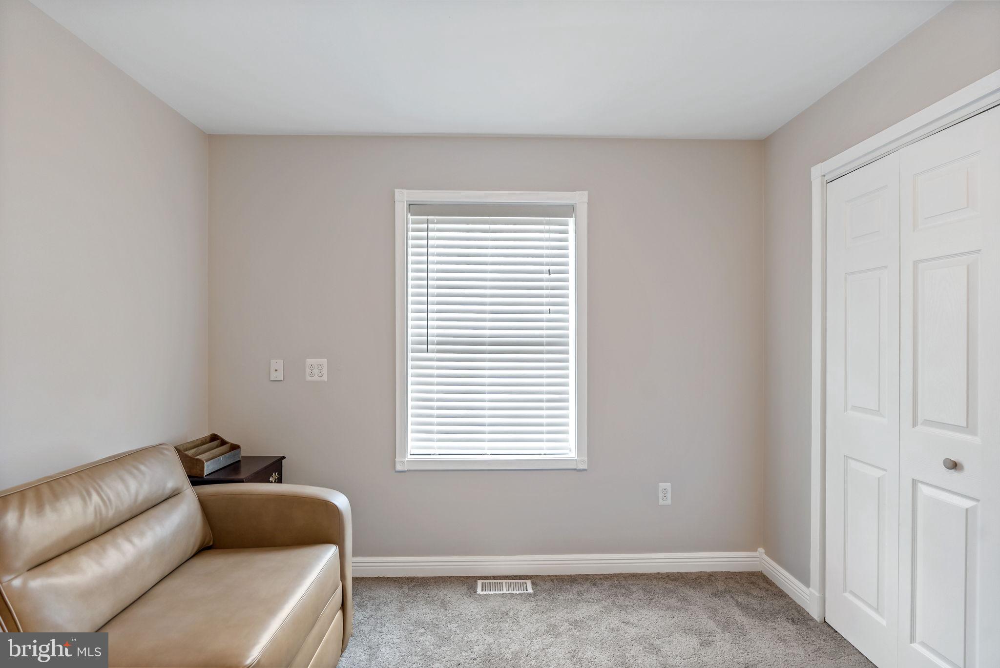 5632 Hines Road Frederick, MD 21704 - Photo 26 of 44 a living room with furniture and a window
