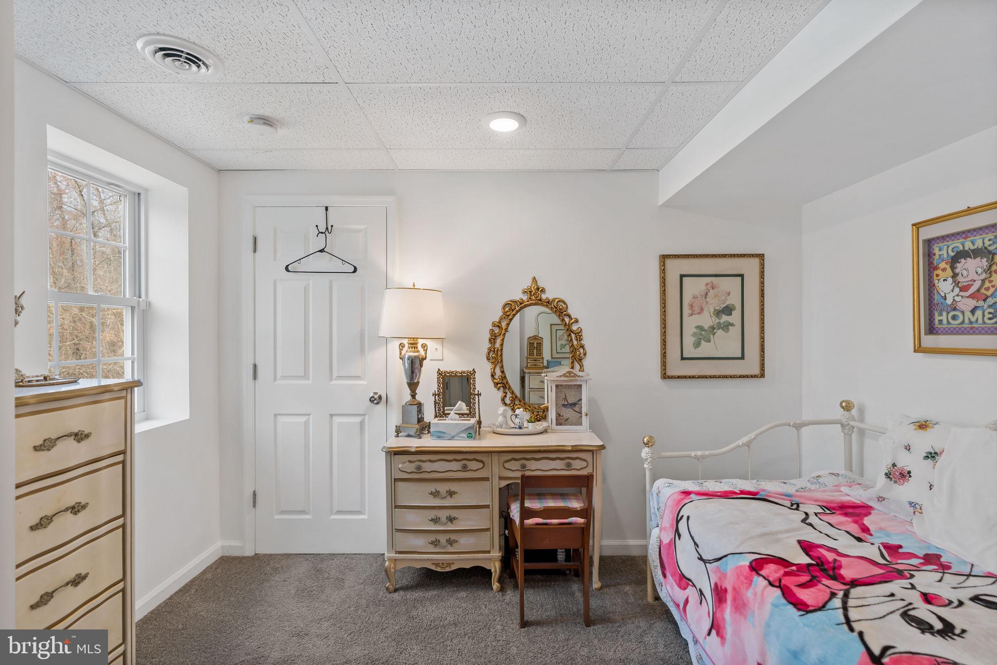 5632 Hines Road Frederick, MD 21704 - Photo 33 of 44 a bedroom with a bed and a dresser