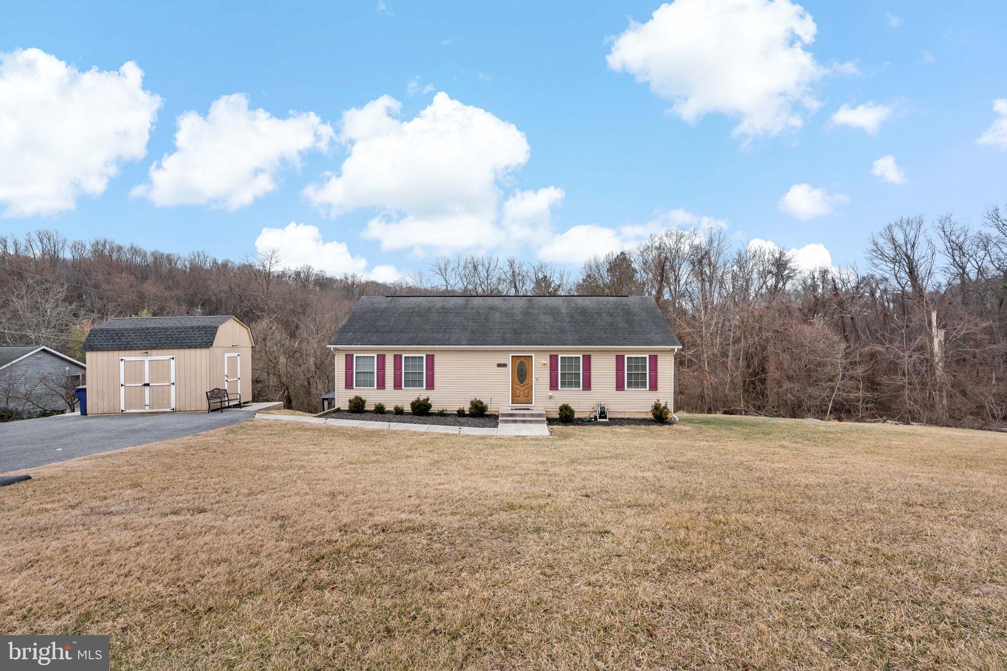 5632 Hines Road Frederick, MD 21704 - Photo 5 of 44 a view of a house with a big yard and a large tree