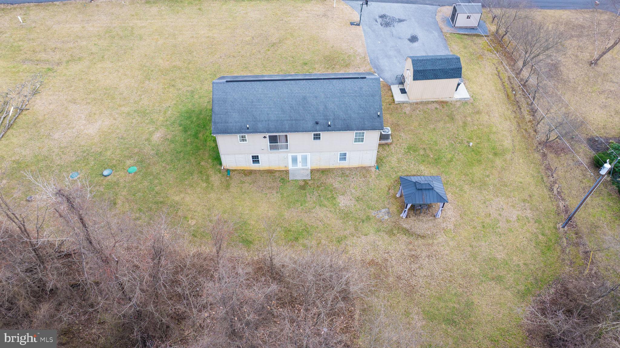 5632 Hines Road Frederick, MD 21704 - Photo 9 of 44 an aerial view of residential house with pool and yard