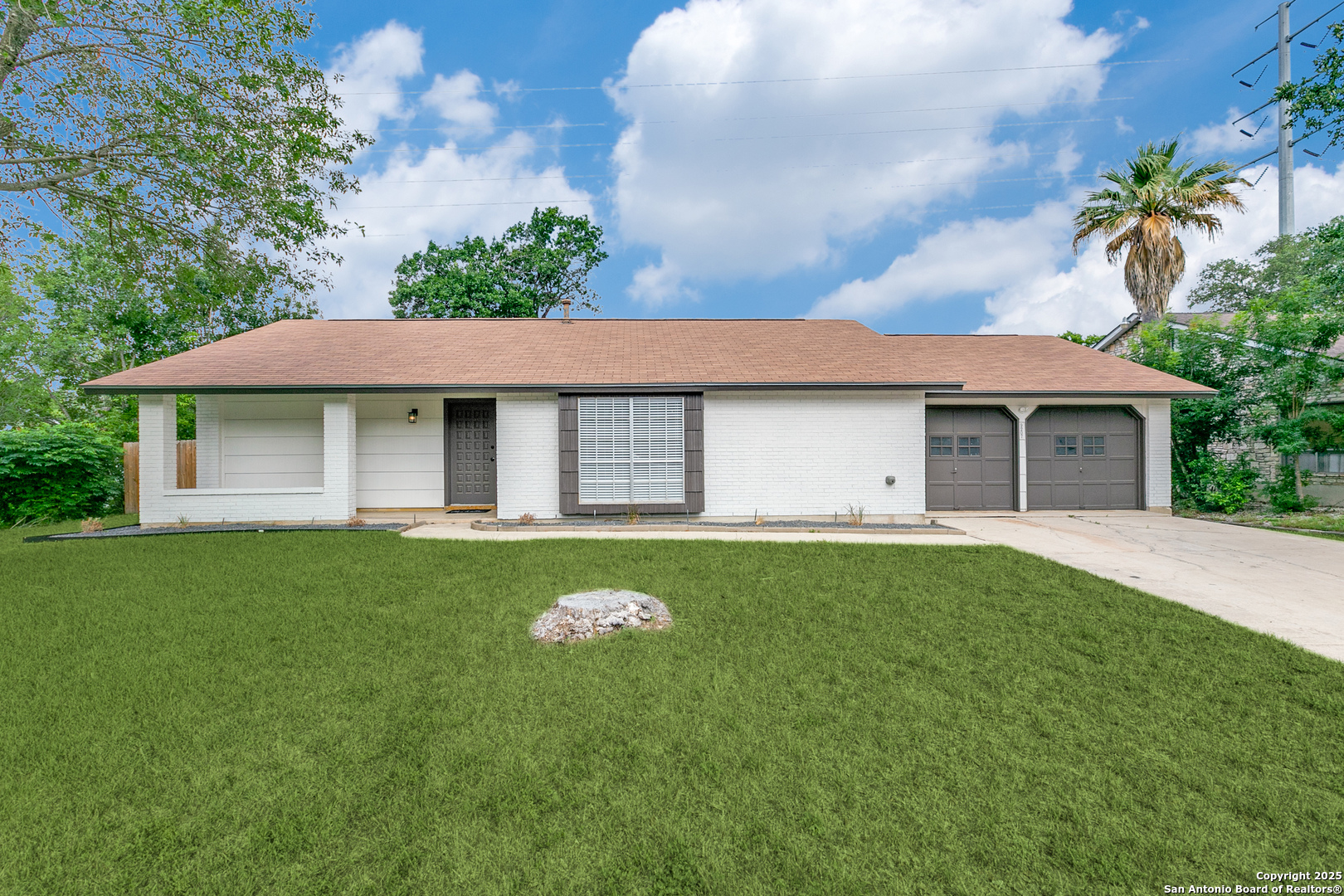 9207 Overton Road San Antonio, TX 78217 - Photo 1 of 1 a front view of a house with a garden
