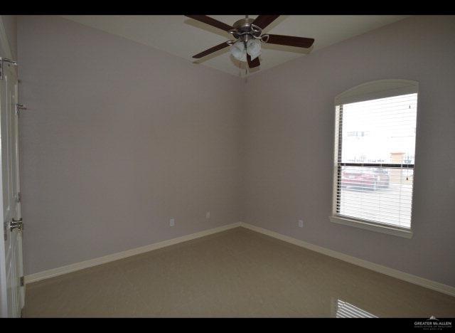2705 Mimosa Street, Unit 4 Mission, TX 78574 - Photo 5 of 24 an empty room with a window