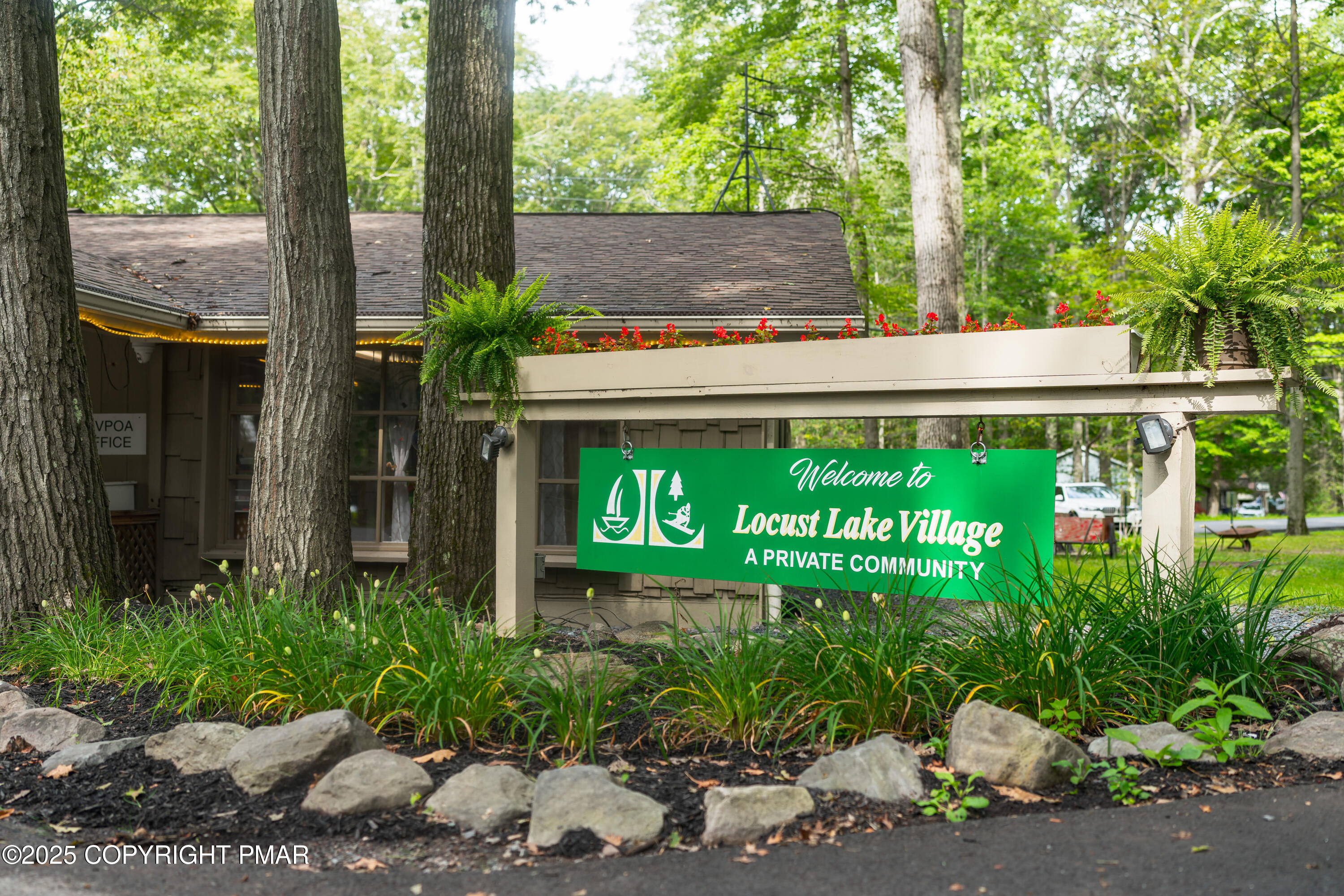 804 Evergreen Road Pocono Lake, PA 18347 - Photo 5 of 19 a sign that is on the side of a road