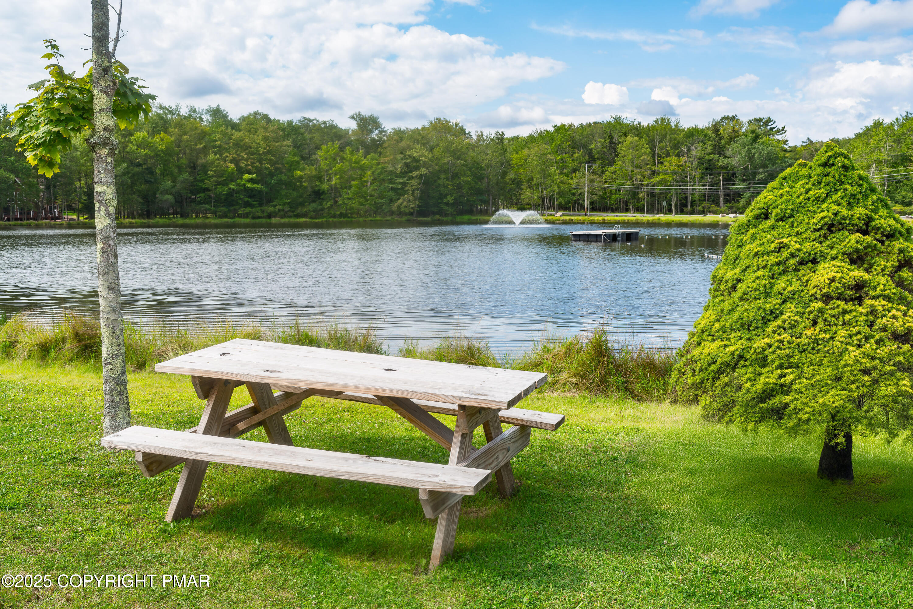 804 Evergreen Road Pocono Lake, PA 18347 - Photo 9 of 19 a view of a lake with outdoor seating