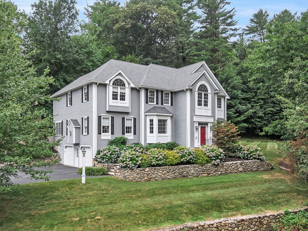 3 Coderre Way Andover, MA 01810 - Photo 1 of 42 a front view of a house with a garden
