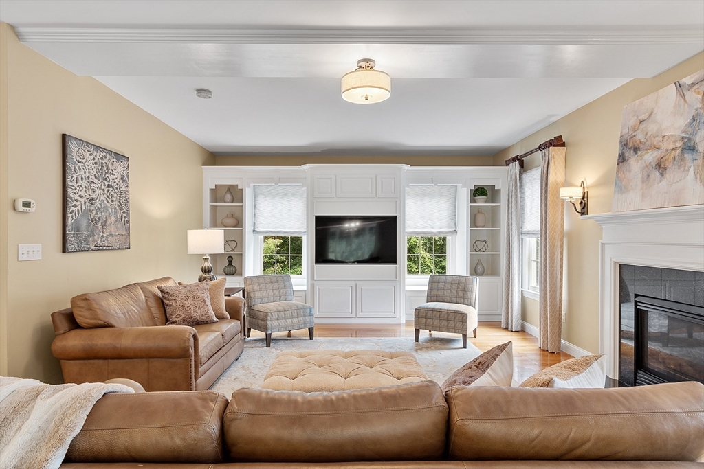 3 Coderre Way Andover, MA 01810 - Photo 12 of 42 a living room with furniture and a flat screen tv